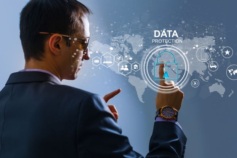 Business professional interacting with a digital data protection interface, illustrating the role of a DPO in GDPR compliance.